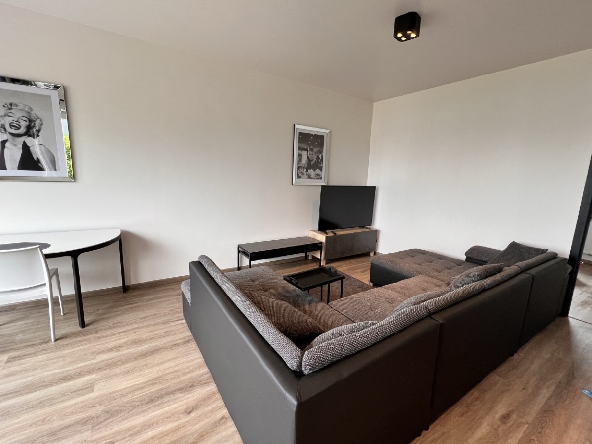 Renovated living room of the Atomium Apartment in Strombeek, Grimbergen